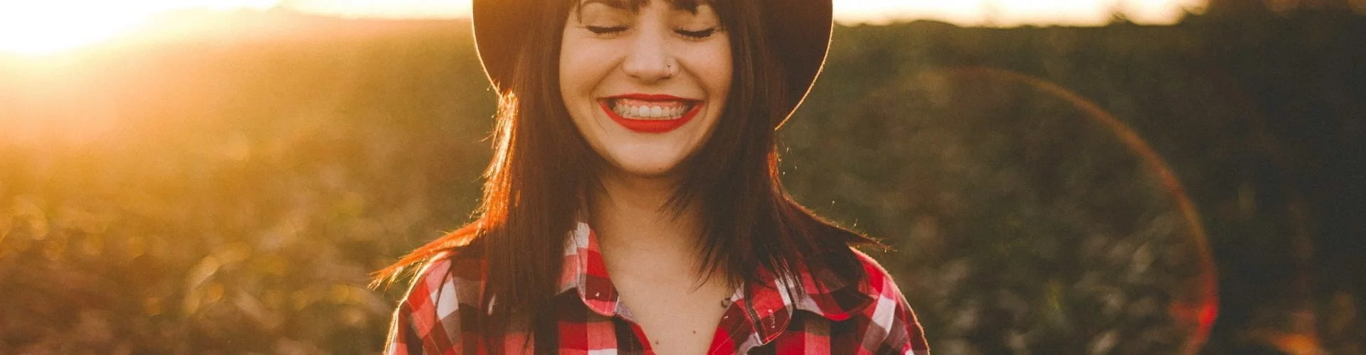 woman smiling at sunset