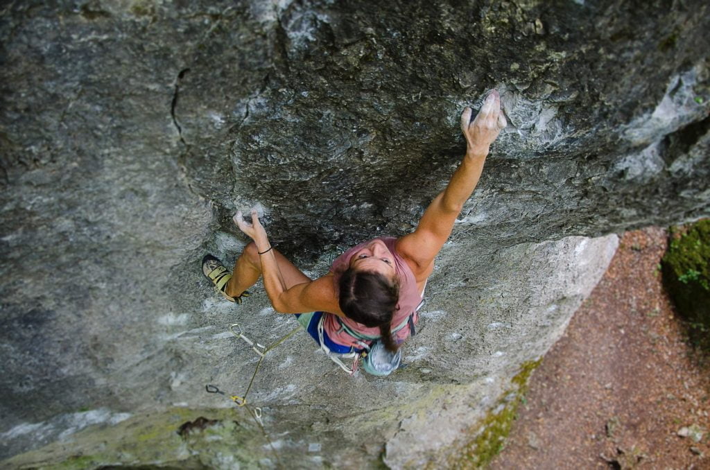 Woman climbing rocks