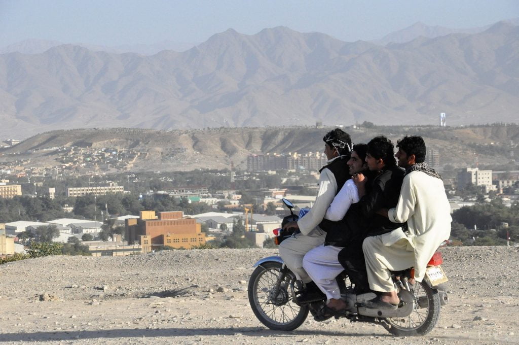 Teens riding a motorbike